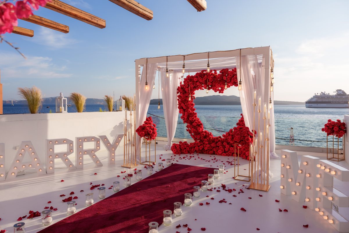 AION's most requested set-up — the red rose heart arch, MARRY ME letters and a petal carpet under the white canopy