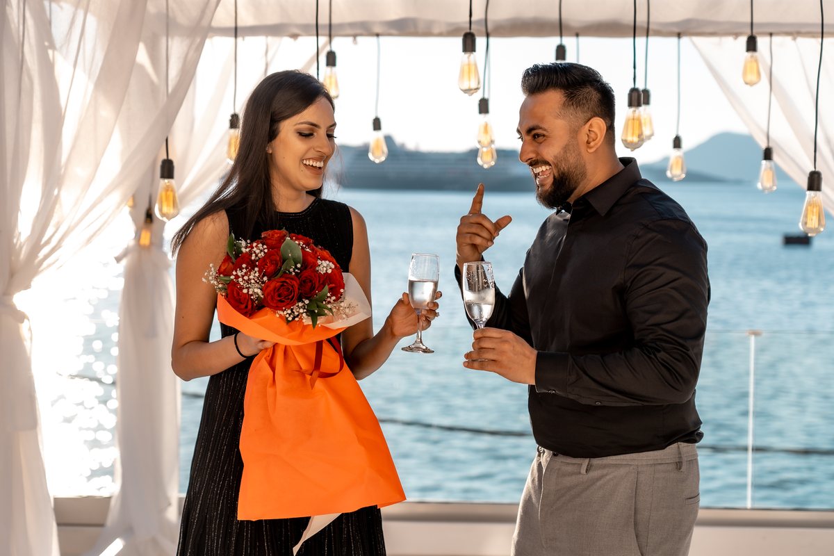 Champagne and red roses on AION's terrace, moments after the proposal