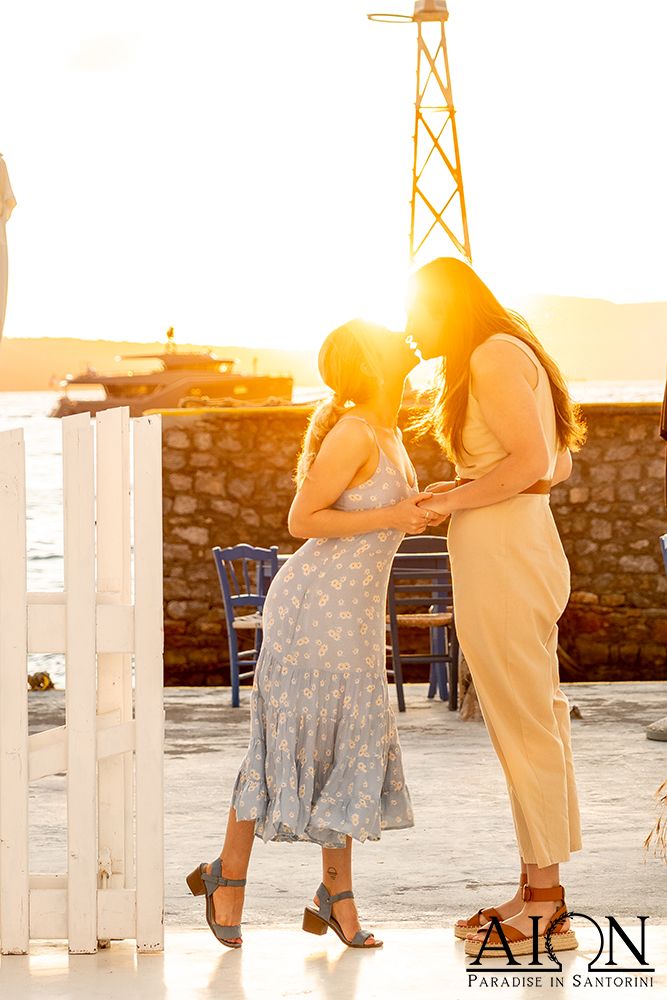 A kiss at the venue's stone entrance in the last of the light
